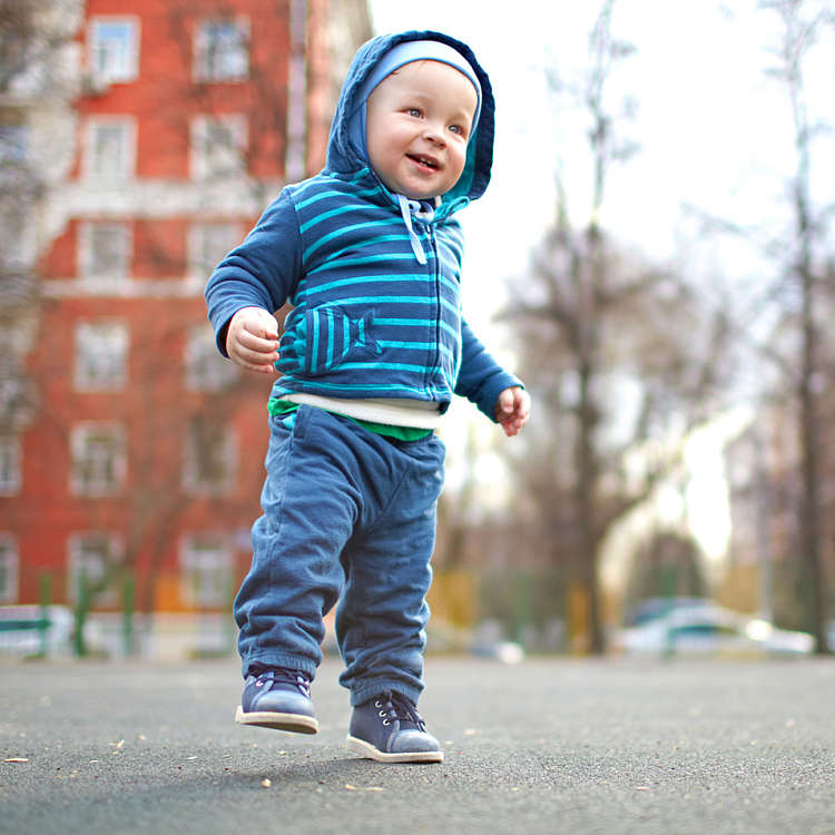 Baby boy goes for a walk outdoors